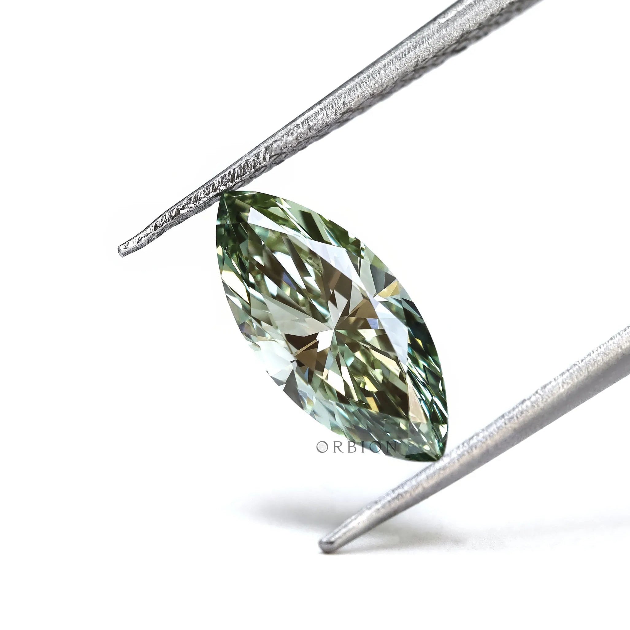 Vivid green marquise lab diamond close up side angle