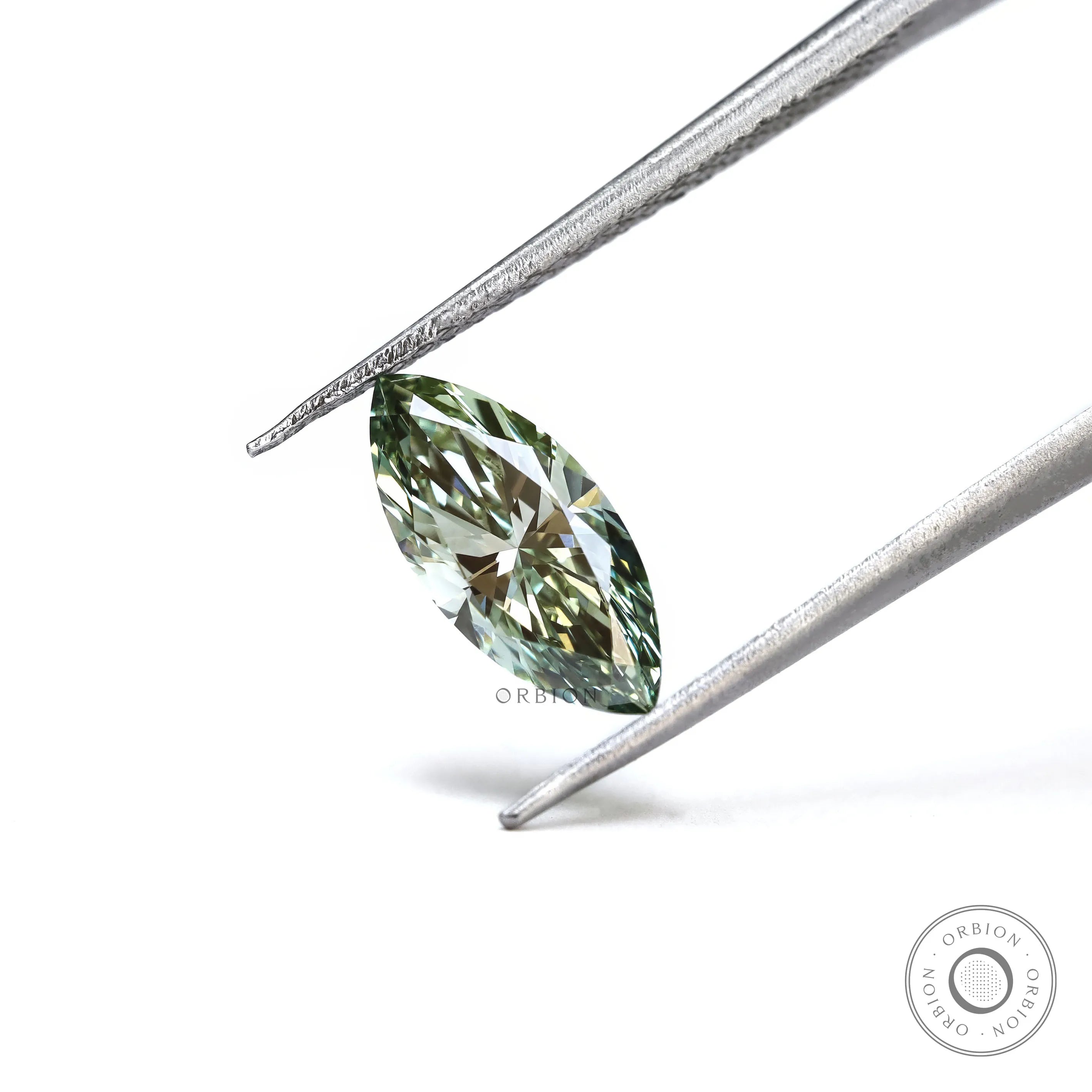 Vivid green marquise lab diamond close up side angle