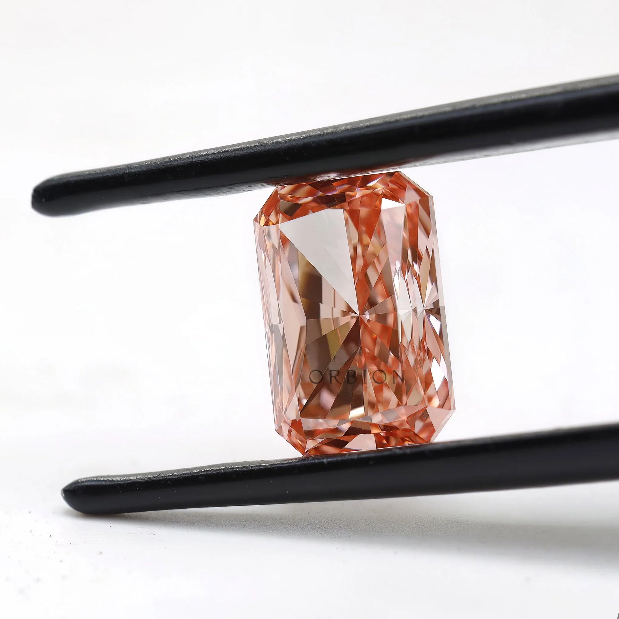 Front angled radiant brilliant cut fancy pink loose diamond
