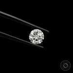 Angled view round nova cut loose lab diamond against black background
