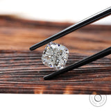 Angled brilliant cut cushion loose lab diamond on wood