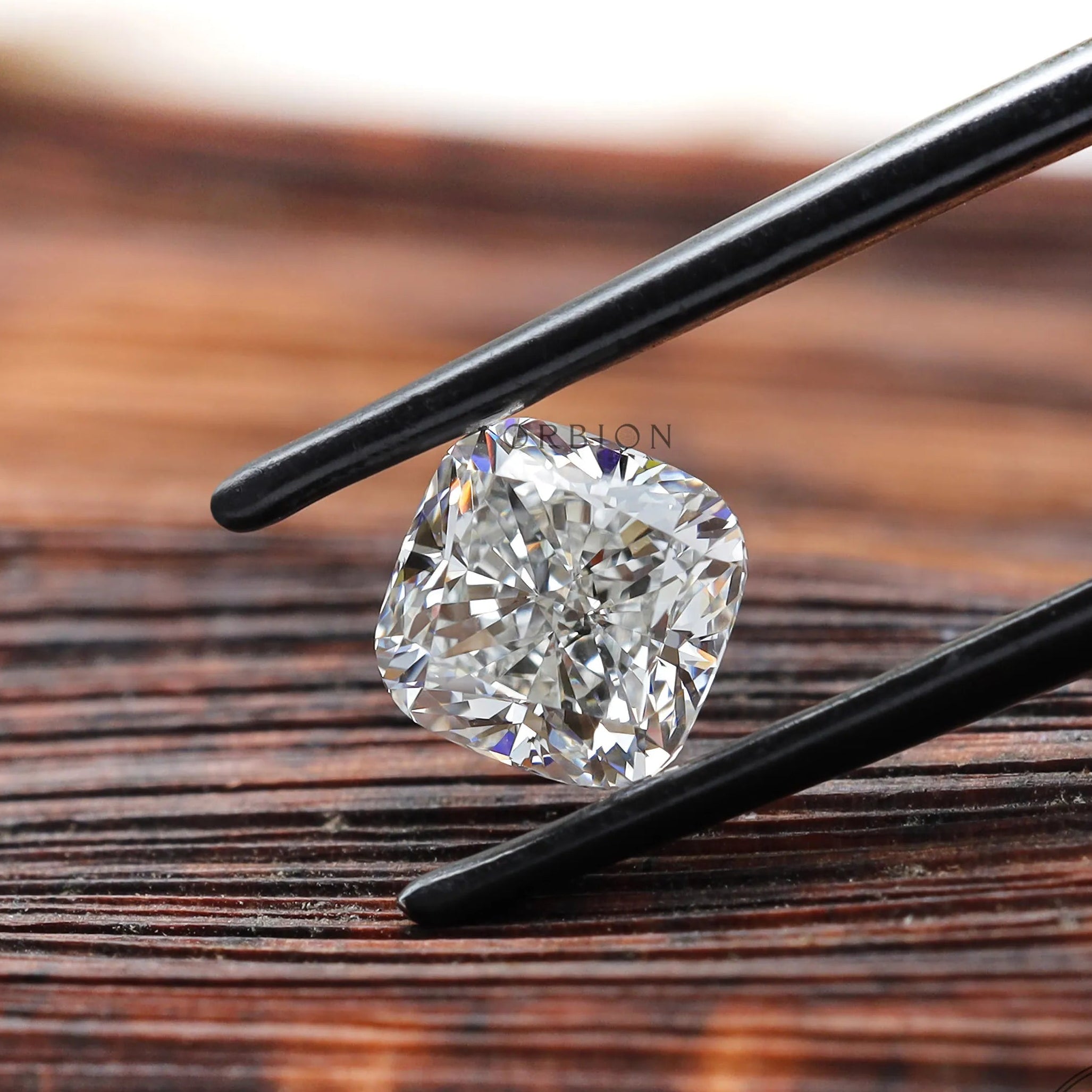 Angled brilliant cut cushion loose lab diamond on wood