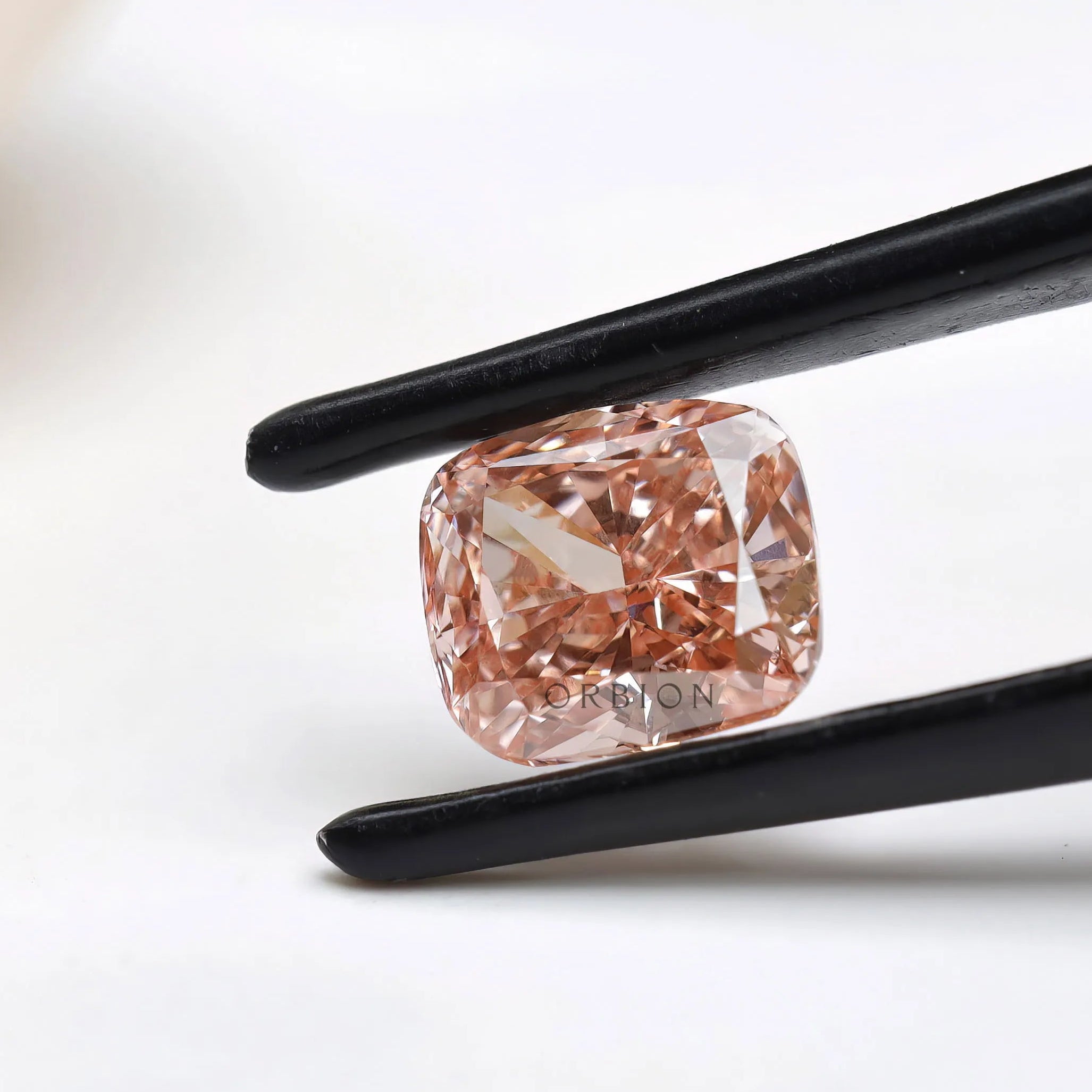 Angled view of fancy pink cushion brilliant lab diamond