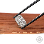 Angled elongated cushion brilliant cut lab diamond in black tweezers