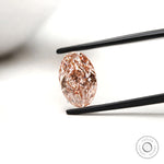 Oval pink lab diamond side angle showing brilliance and fire