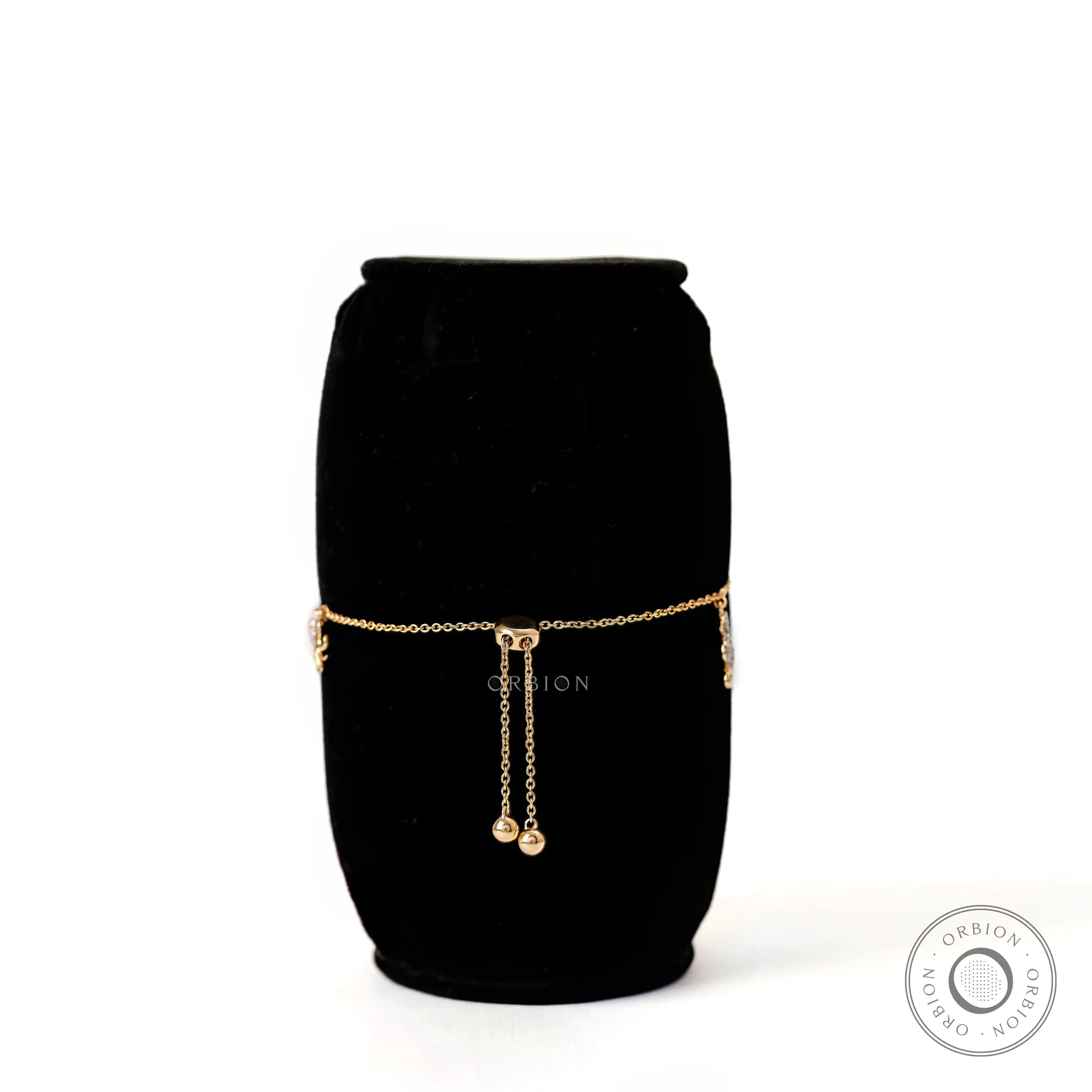 Back closure view yellow gold ocean charm bolo bracelet