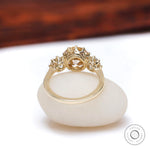 Back view three stone champagne moissanite ring yellow gold