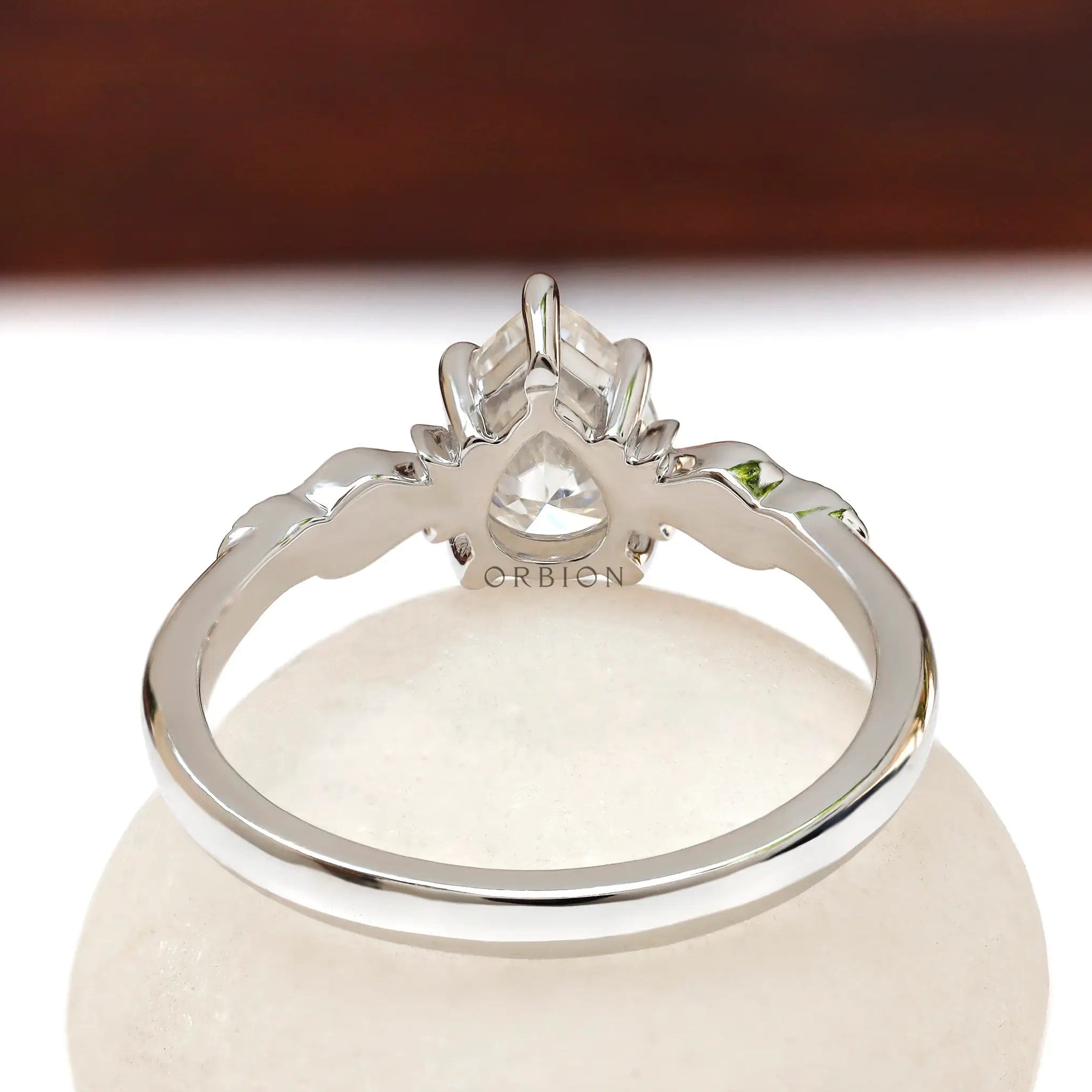 Back view of leaf engravings on Moissanite engagement ring band