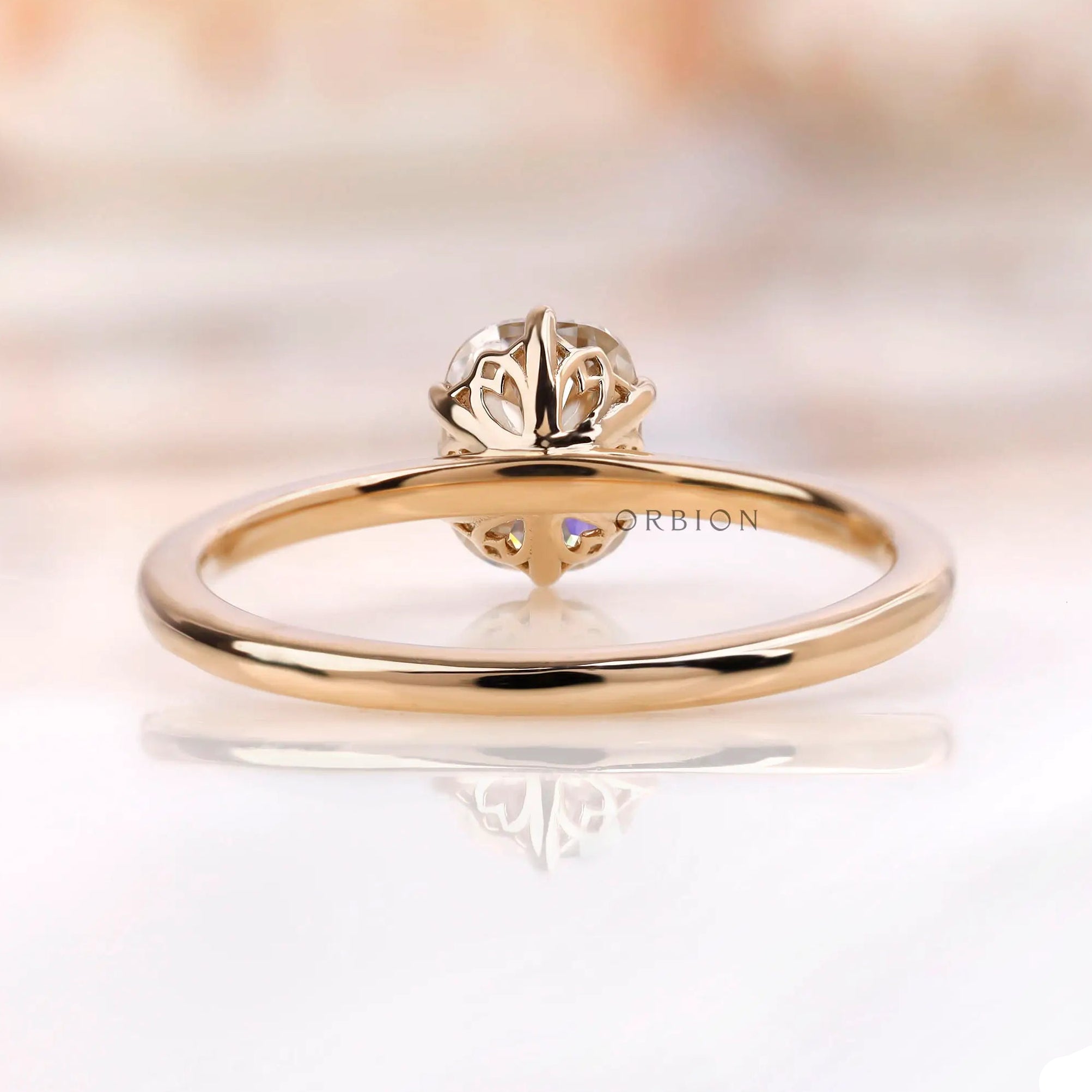Back view of elongated cushion solitaire ring with tulip basket