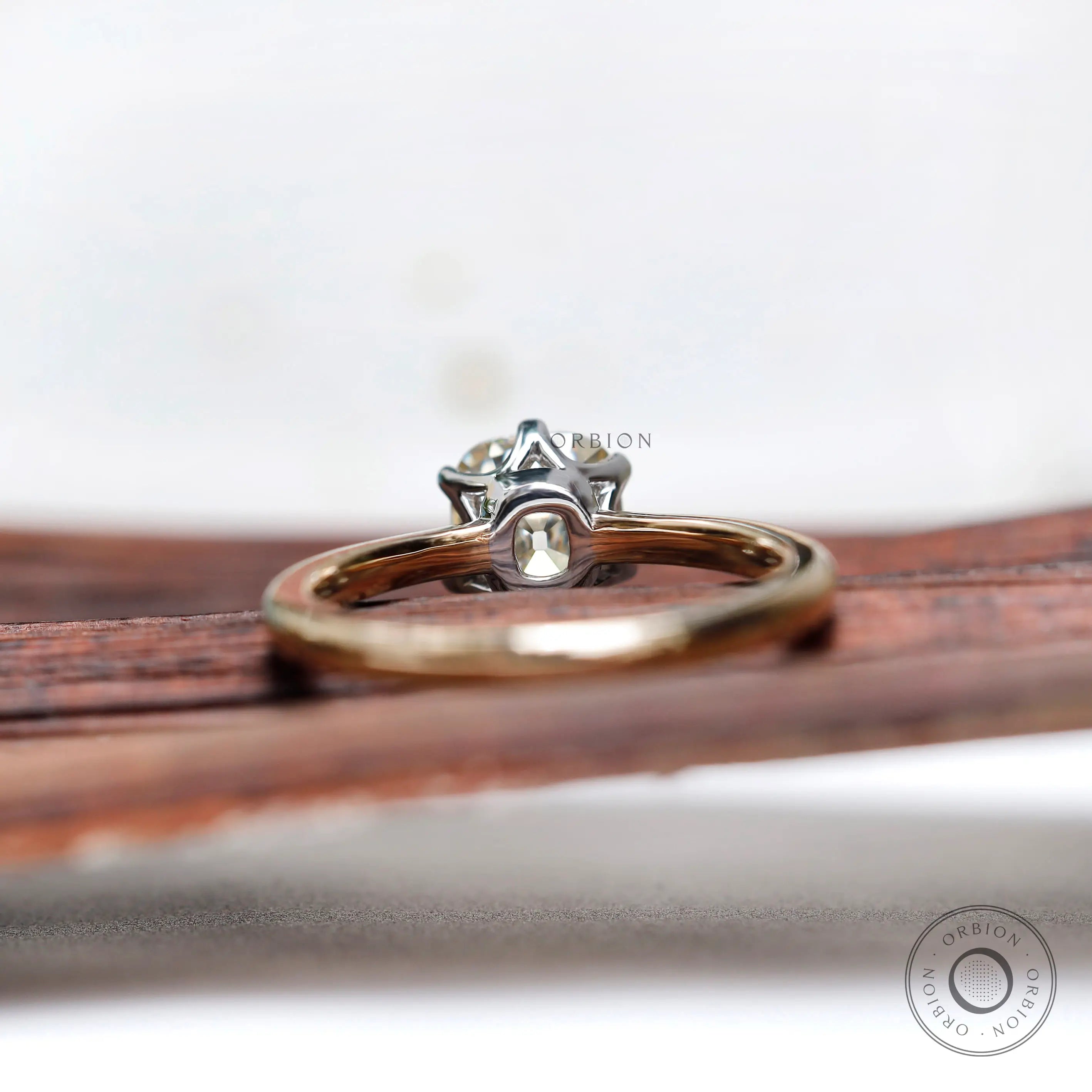 Back view of two tone gold moissanite engagement ring