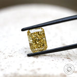Angled view radiant brilliant cut fancy yellow lab diamond
