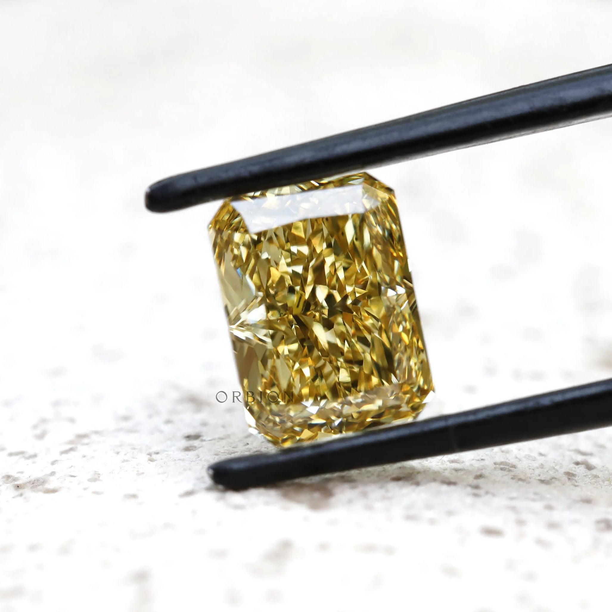 Angled view radiant brilliant cut fancy yellow lab diamond