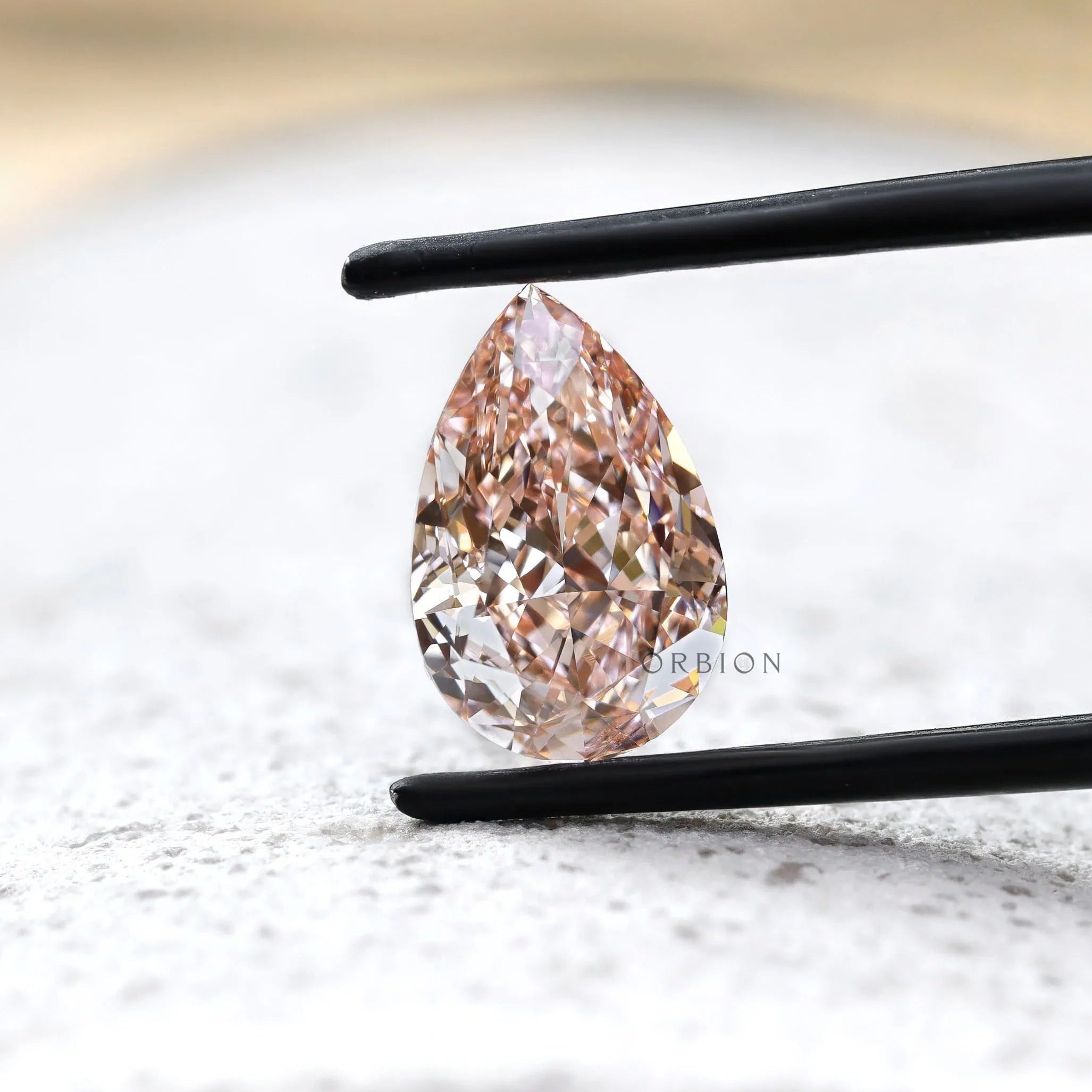 Close view of pink pear brilliant cut lab diamond