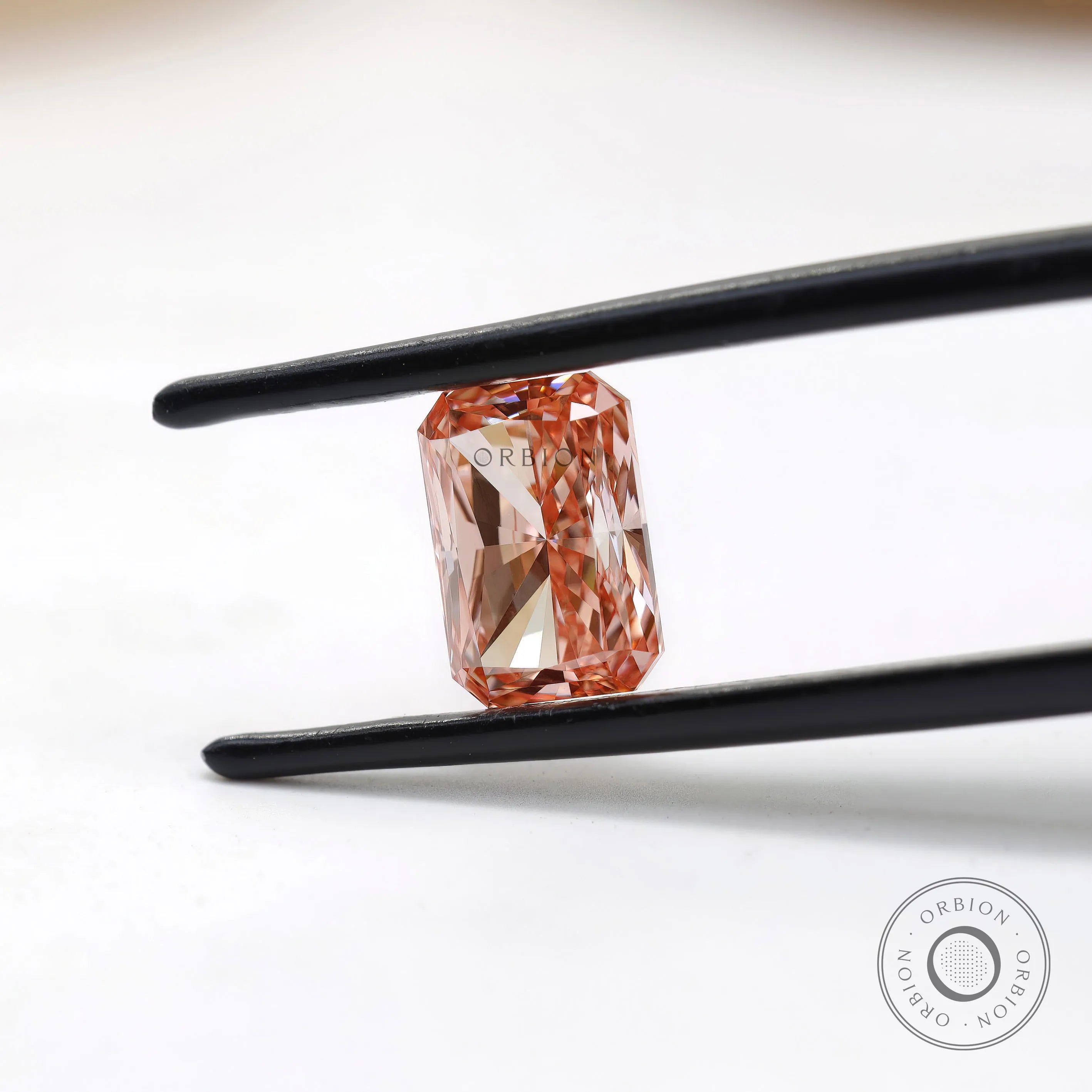 Side profile of fancy pink radiant cut lab diamond