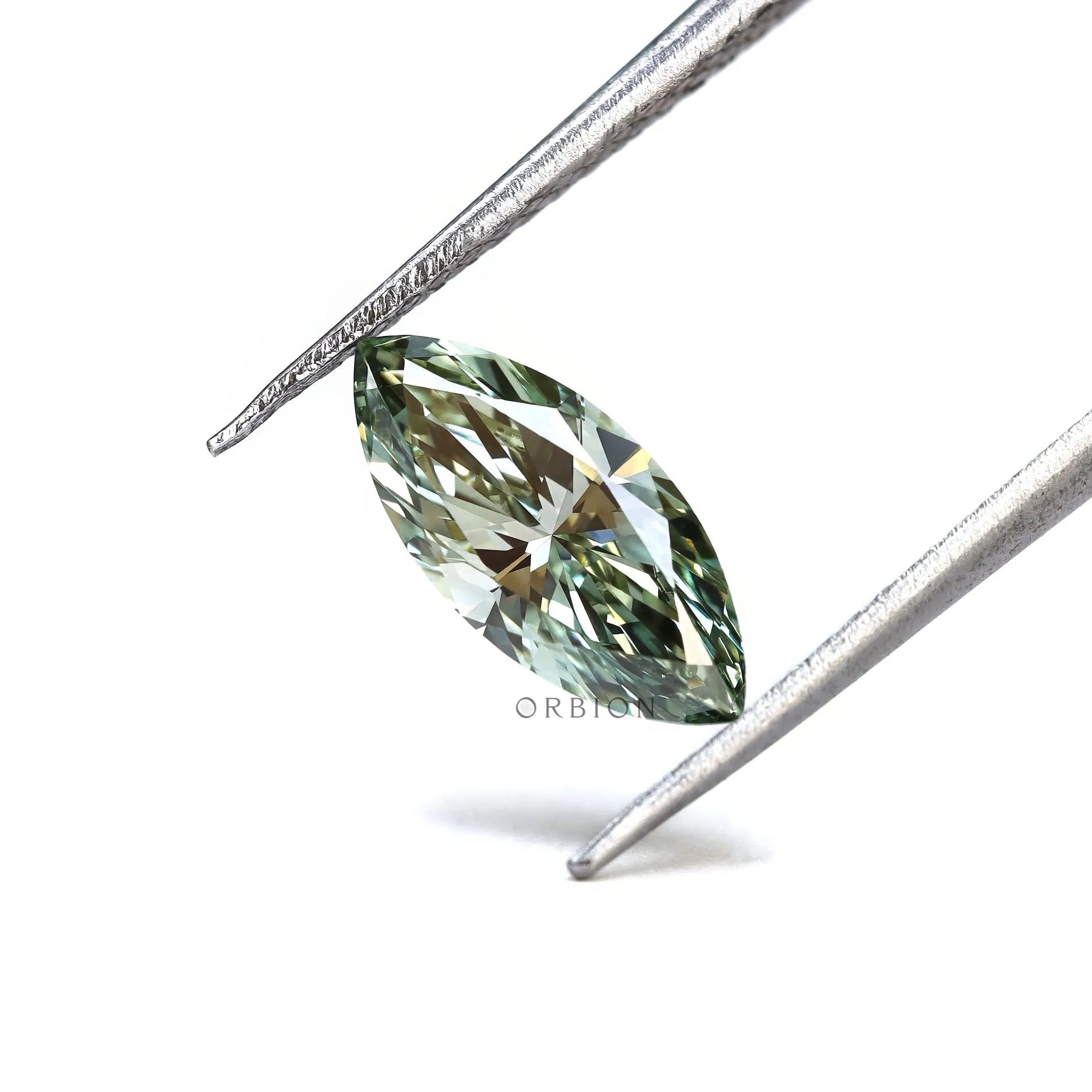 Fancy vivid green marquise diamond on textured surface