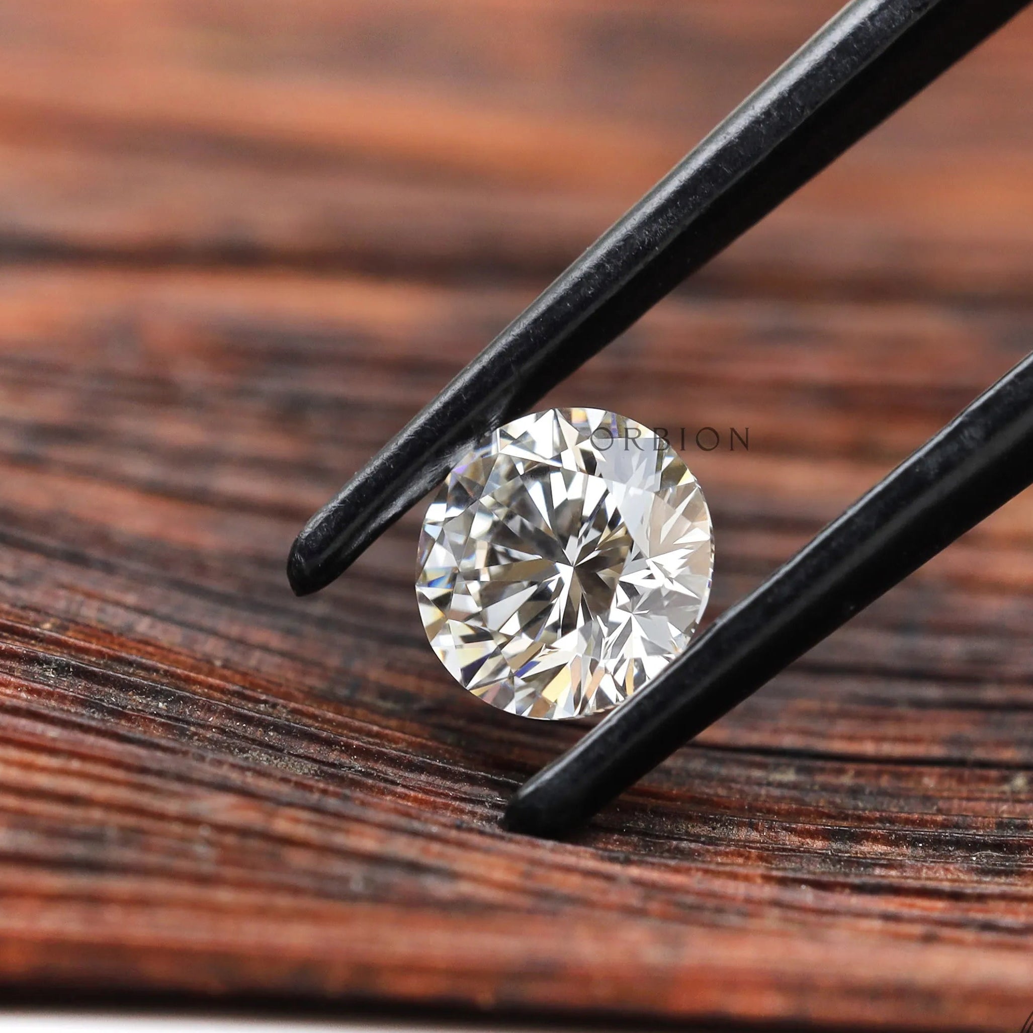Side angle view of round brilliant lab diamond