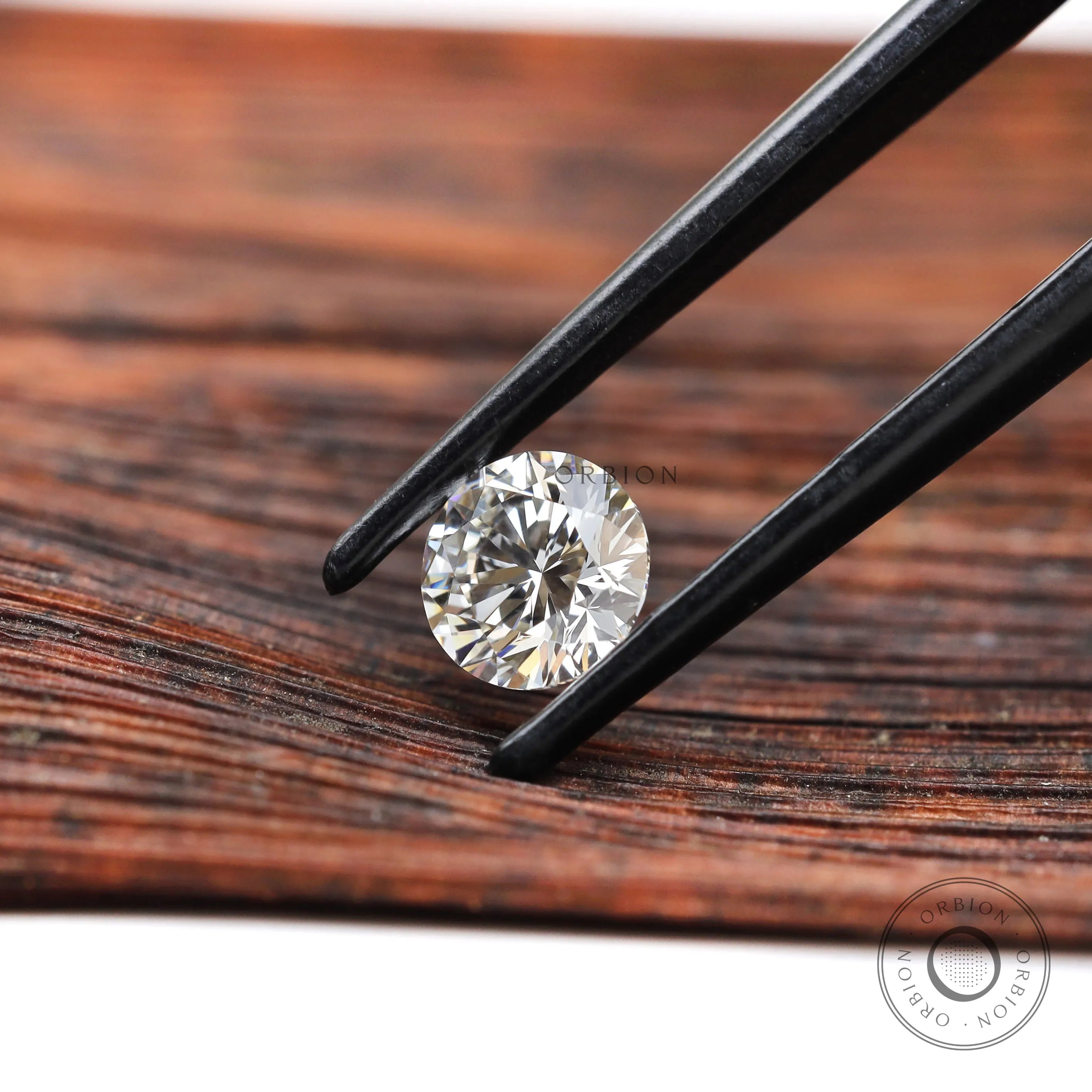 Side angle view of round brilliant lab diamond