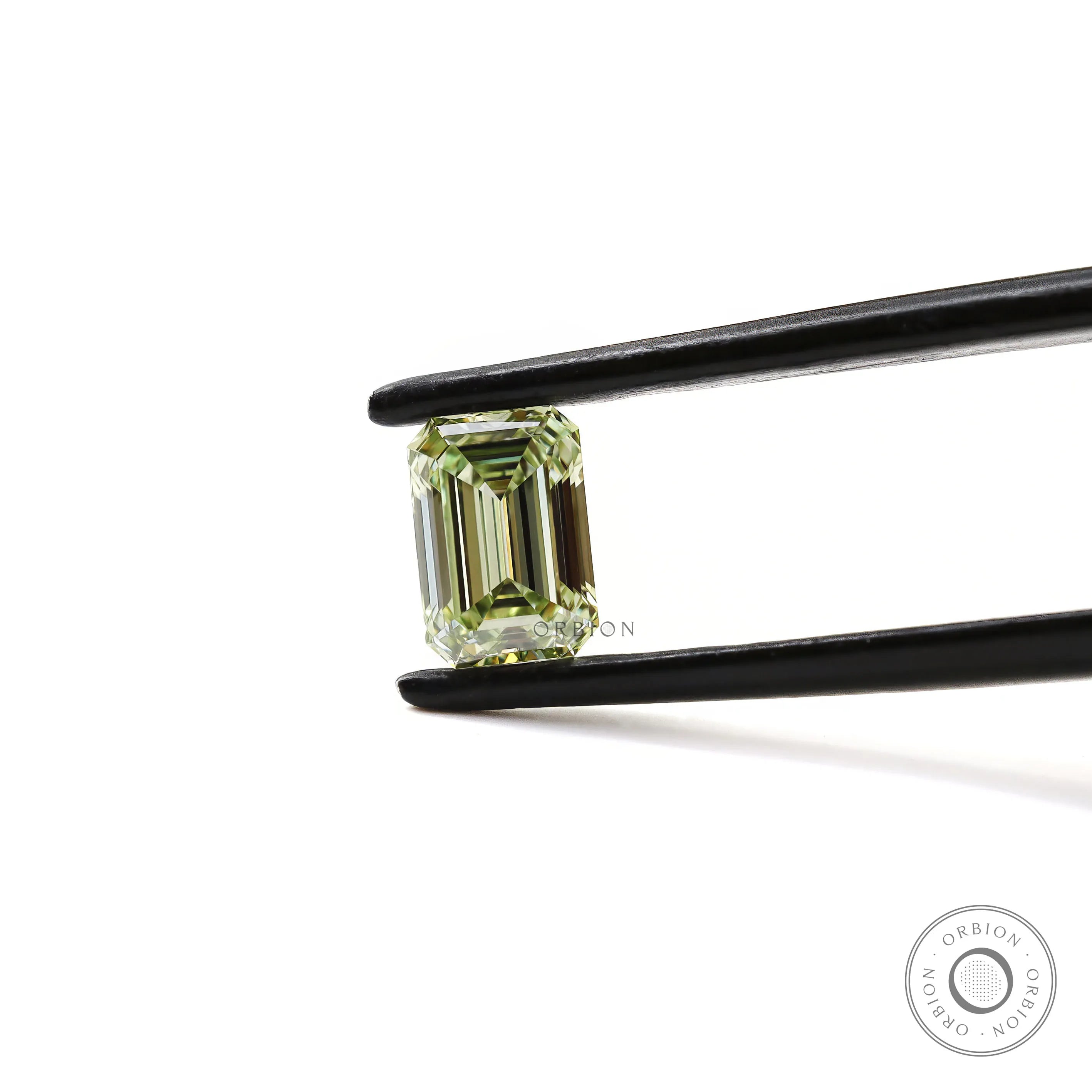 Emerald step cut green loose lab diamond angled view