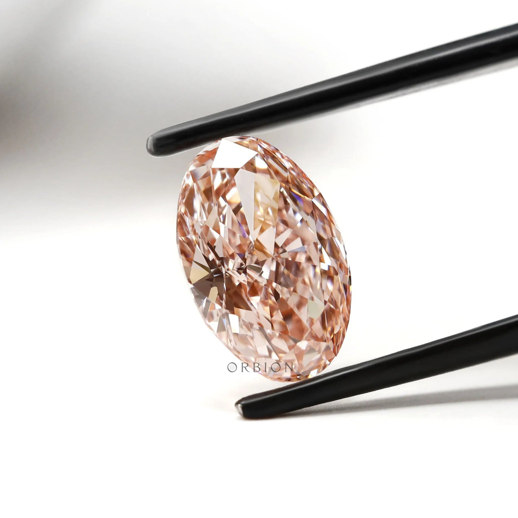 Angled oval pink diamond highlighting modified brilliant cut sparkle