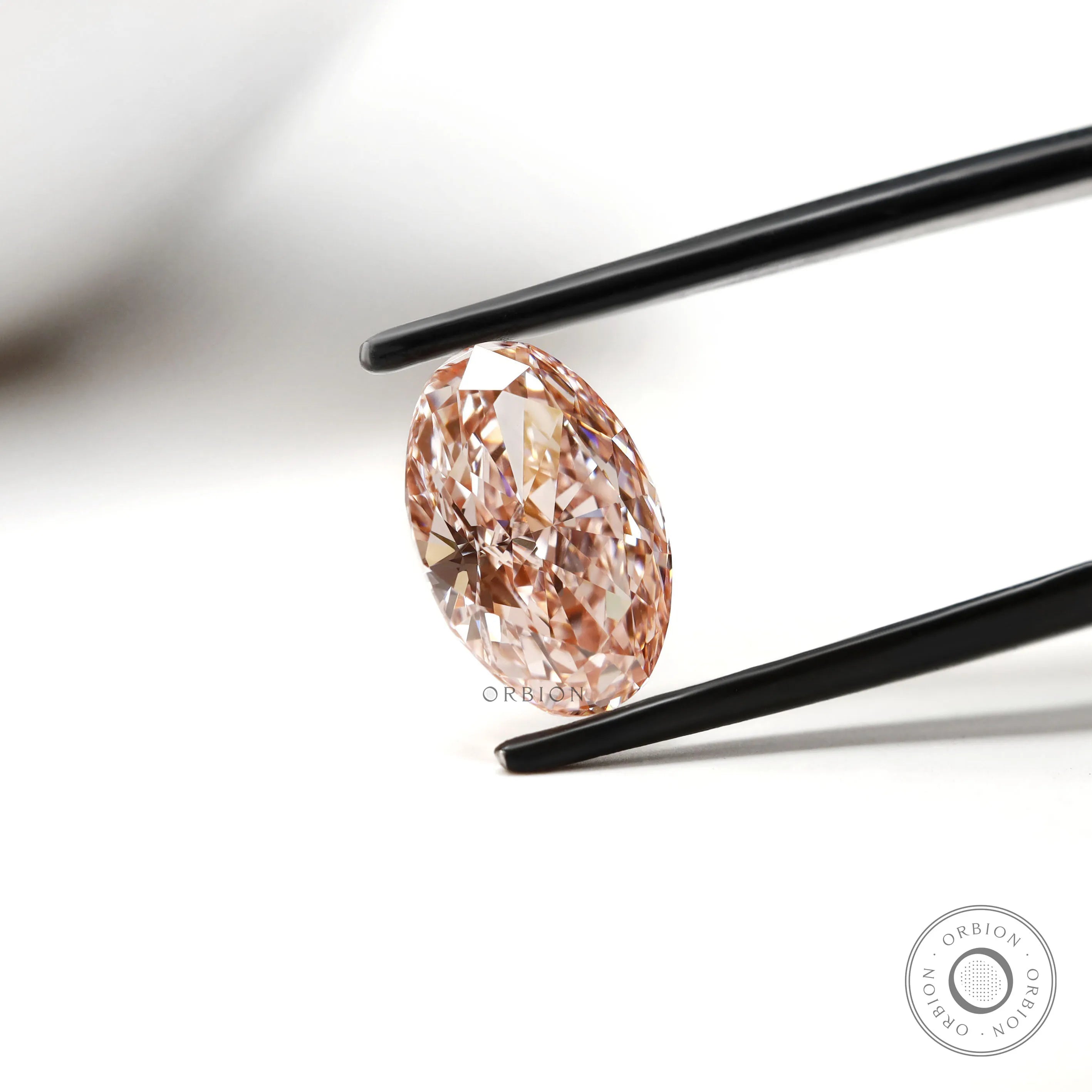Angled oval pink diamond highlighting modified brilliant cut sparkle