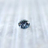 Face-up view of round brilliant intense blue lab diamond