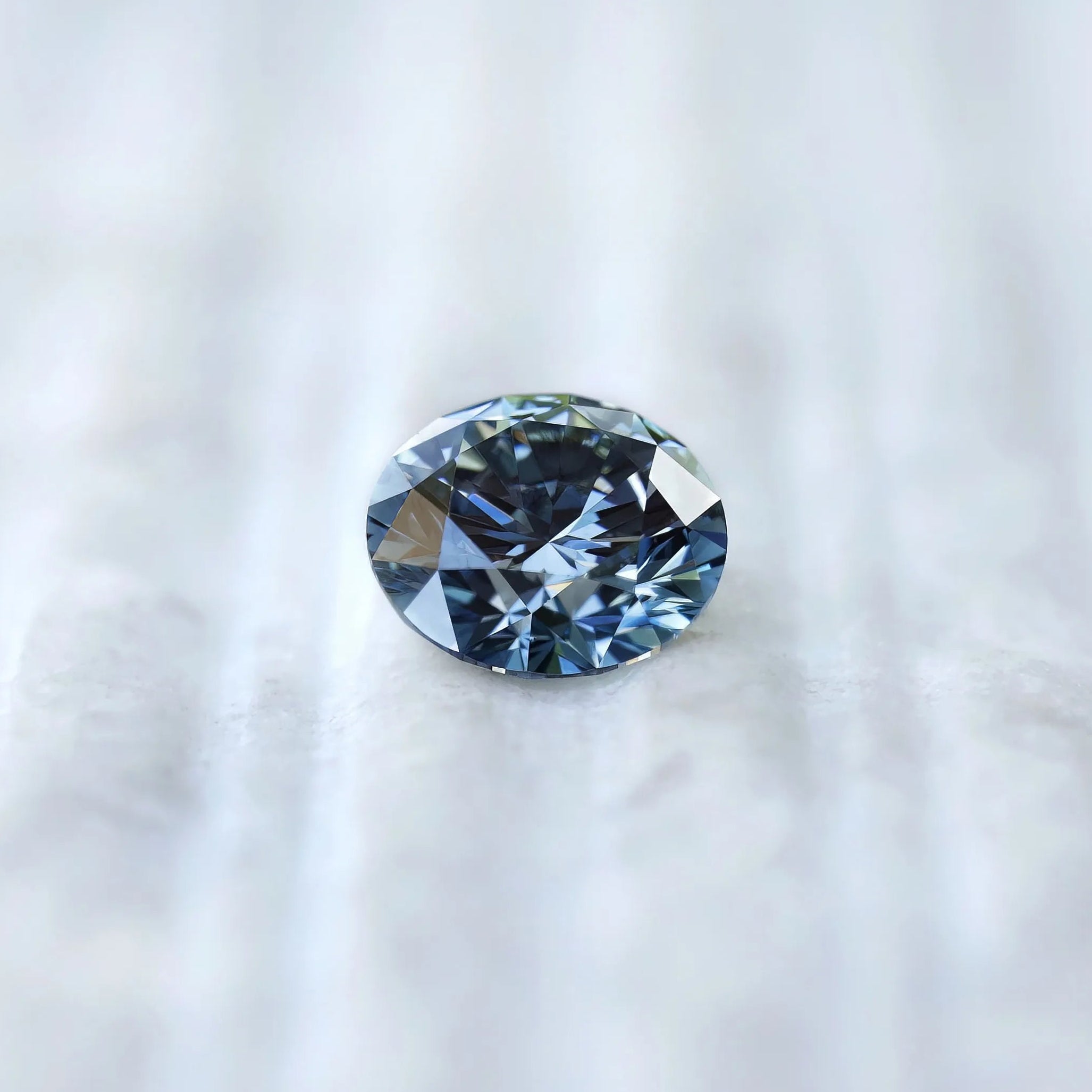 Face-up view of round brilliant intense blue lab diamond