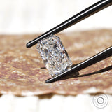 Side angled radiant cut lab diamond on textured surface