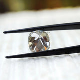 Vintage style cushion moissanite showing broad chunky faceting