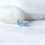Blue radiant cut lab diamond beside neutral display stones
