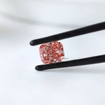 Side profile of vivid pink cushion lab diamond