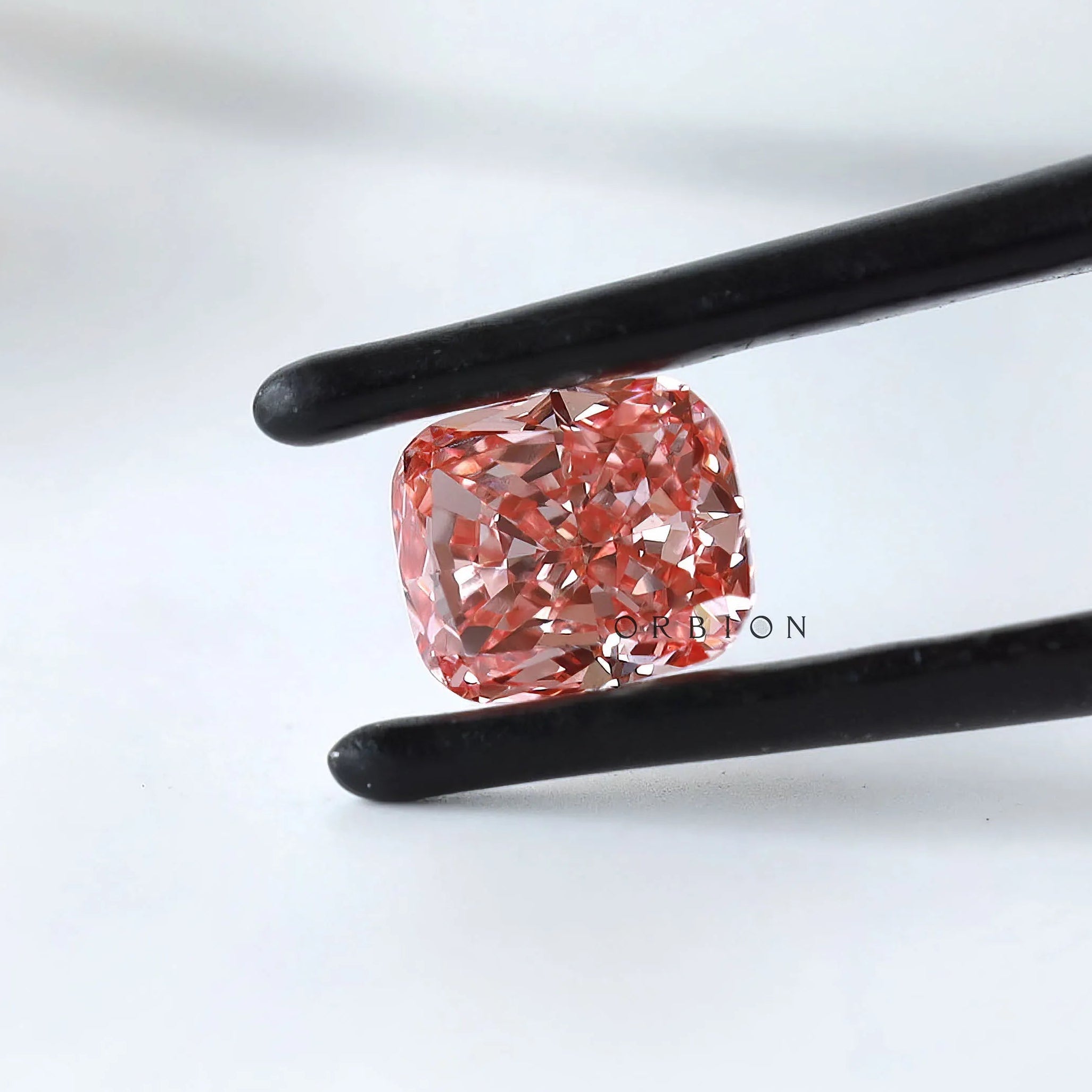 Side profile of vivid pink cushion lab diamond