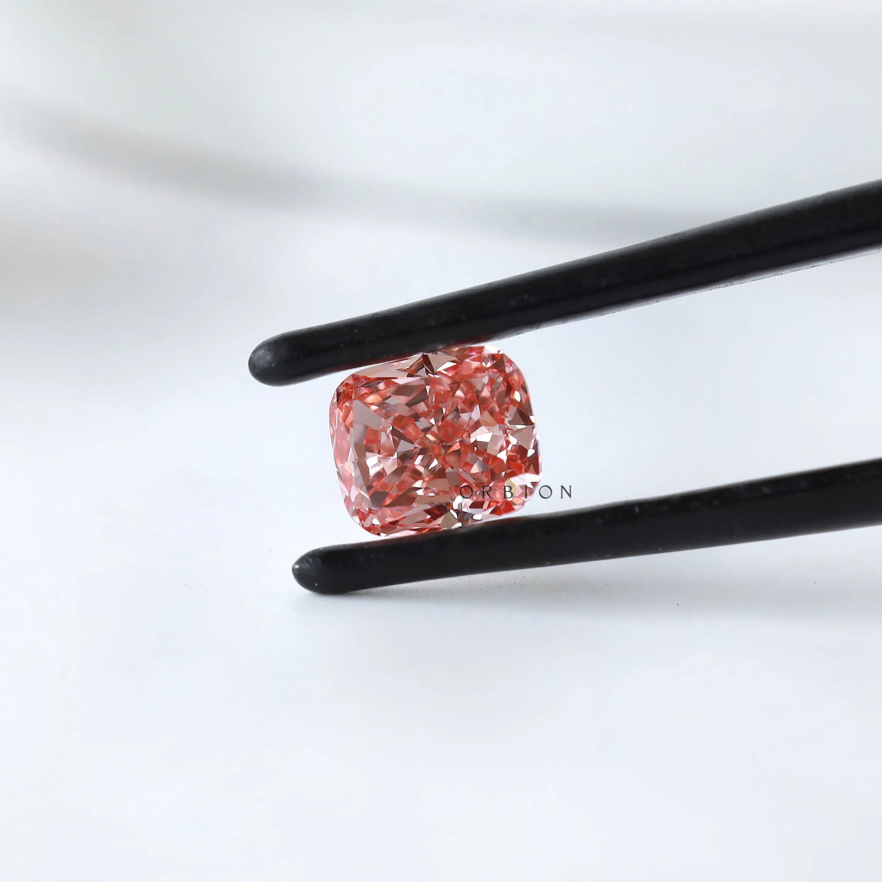 Side profile of vivid pink cushion lab diamond