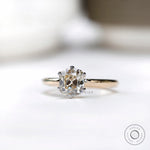 Studio front view of old mine cut cushion moissanite ring