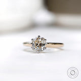 Studio front view of old mine cut cushion moissanite ring