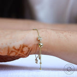 Side worn view adjustable butterfly clover charm bolo bracelet