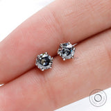 Finger scale view OEC grey moissanite stud earrings