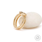 Angled view elongated cushion champagne moissanite bezel ring gold
