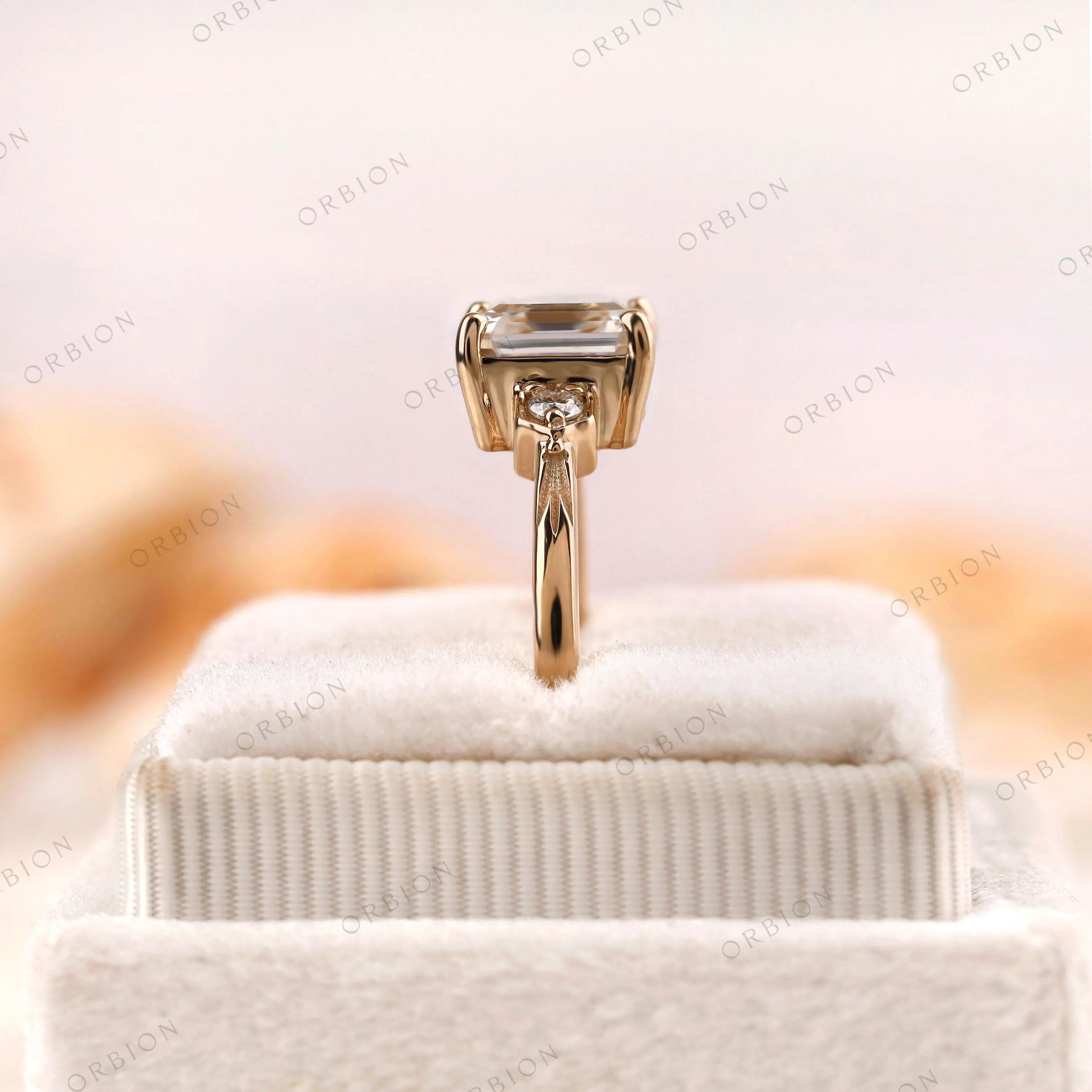 Floral details on asscher moissanite ring in yellow gold