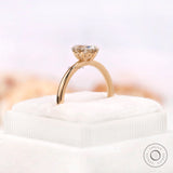 Side elevation of off white moissanite ring with tulip gallery