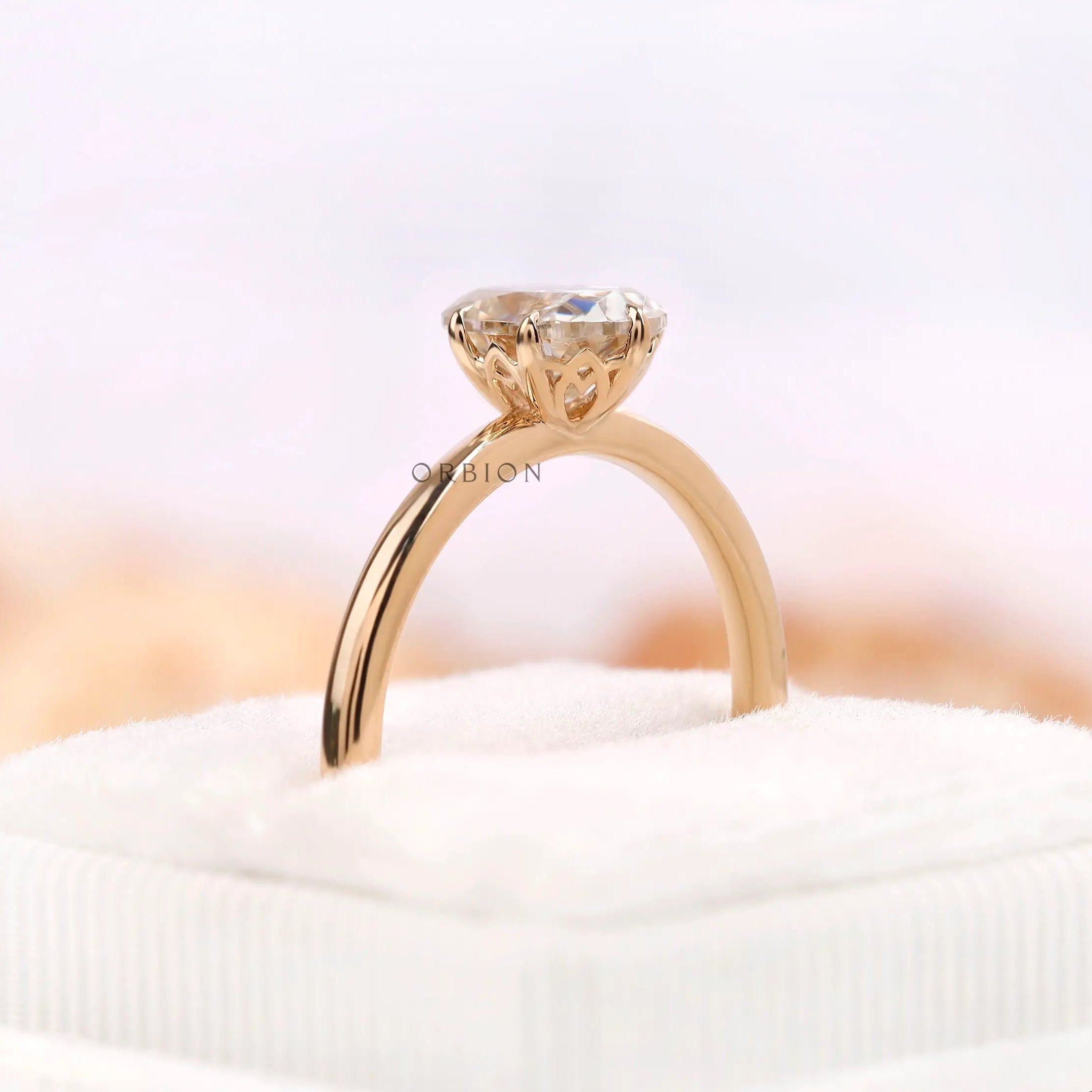 Side elevation of off white moissanite ring with tulip gallery
