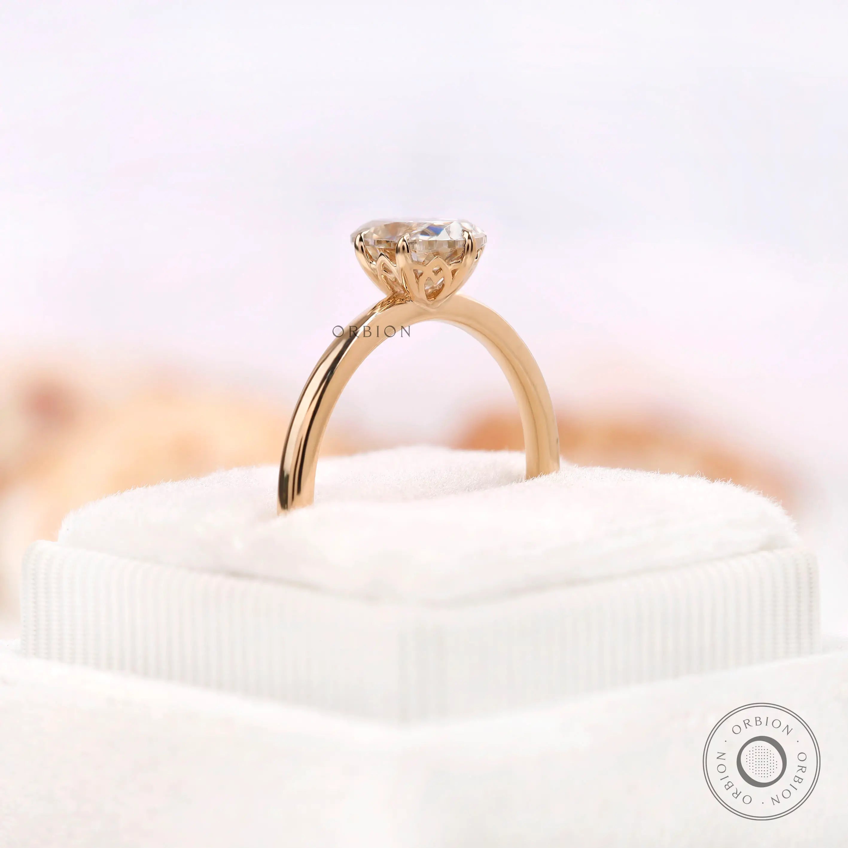 Side elevation of off white moissanite ring with tulip gallery