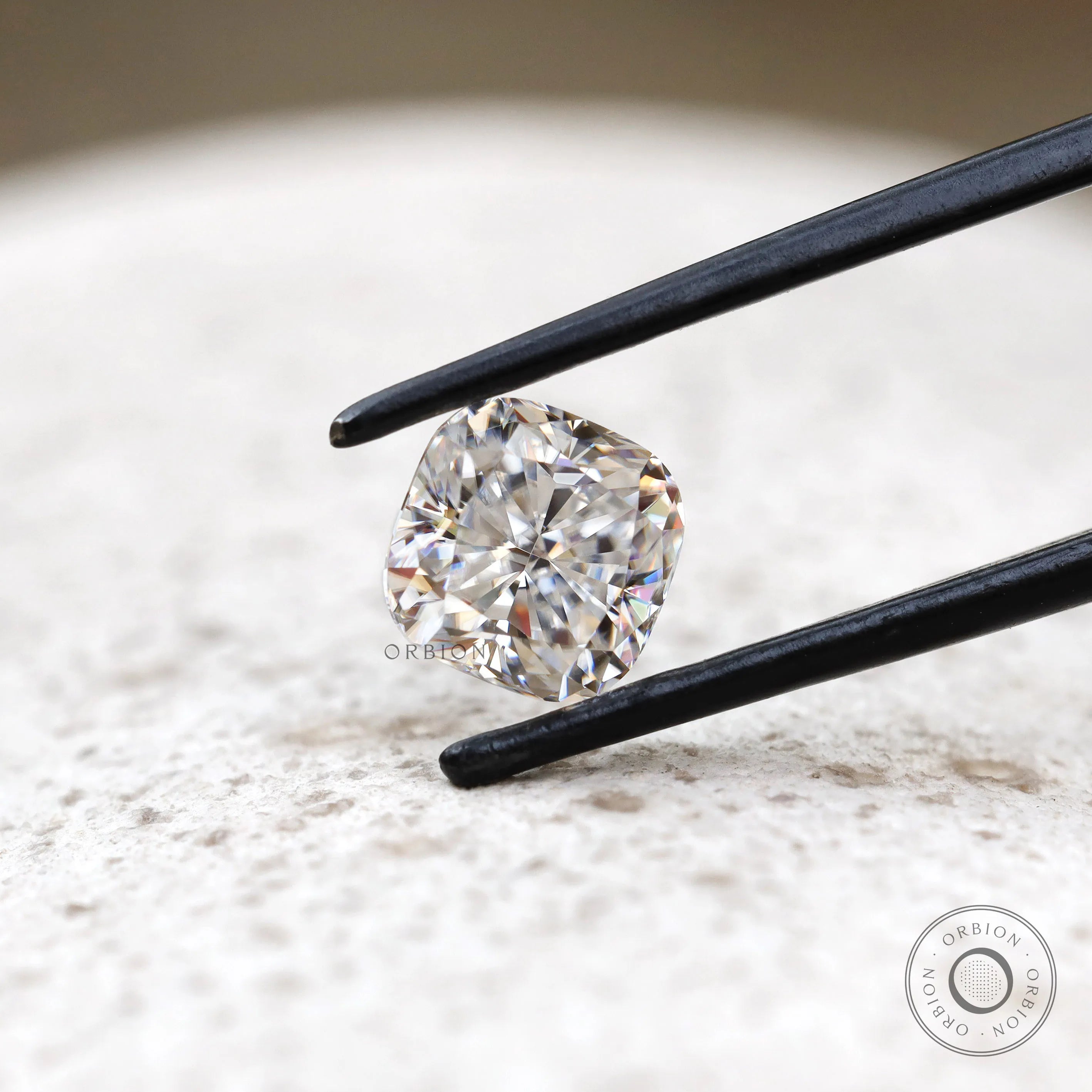Front view cushion brilliant loose moissanite on light surface