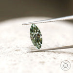 Green marquise brilliant cut loose diamond on display
