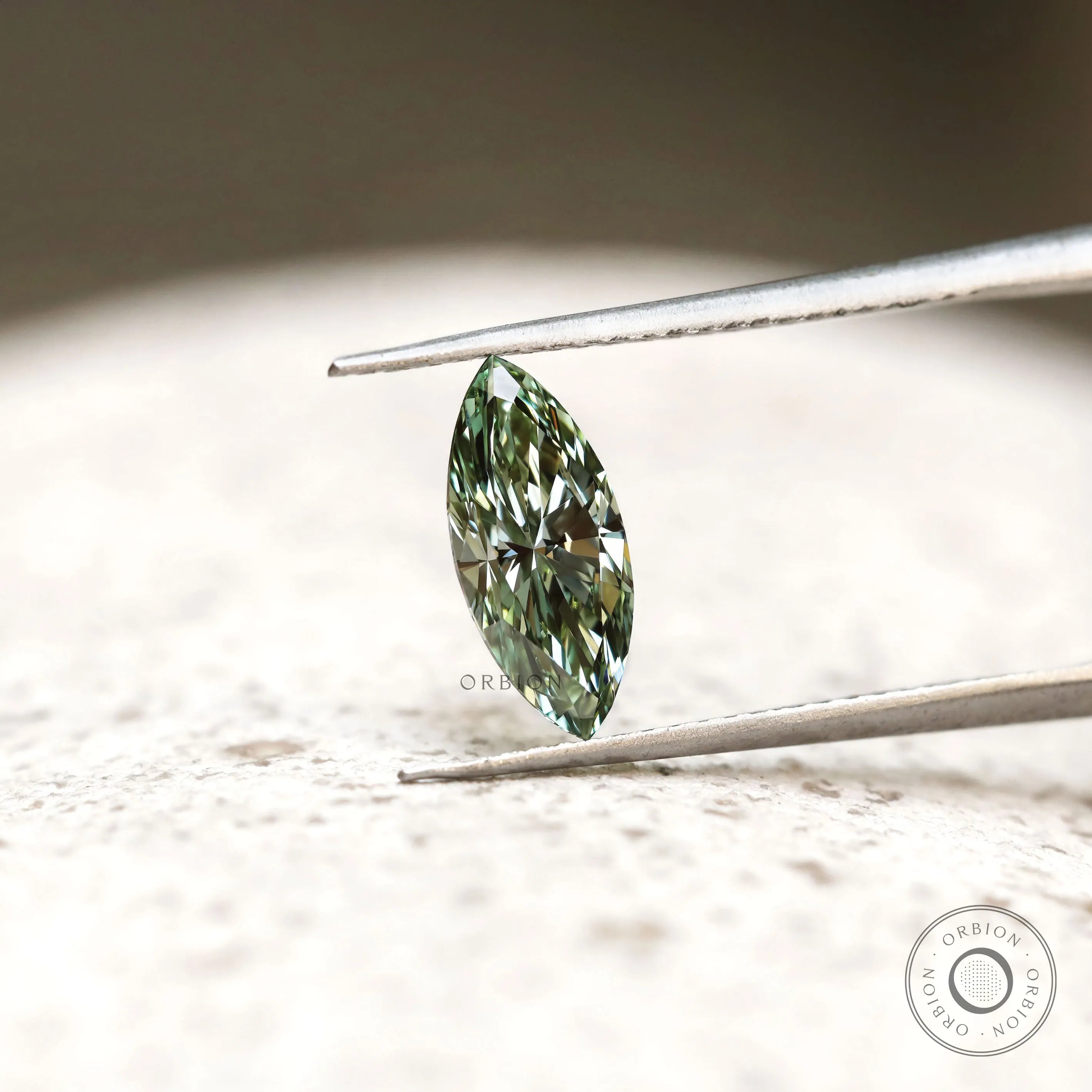 Green marquise brilliant cut loose diamond on display