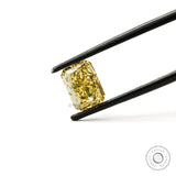 Radiant cut yellow loose lab diamond tilted in tweezers