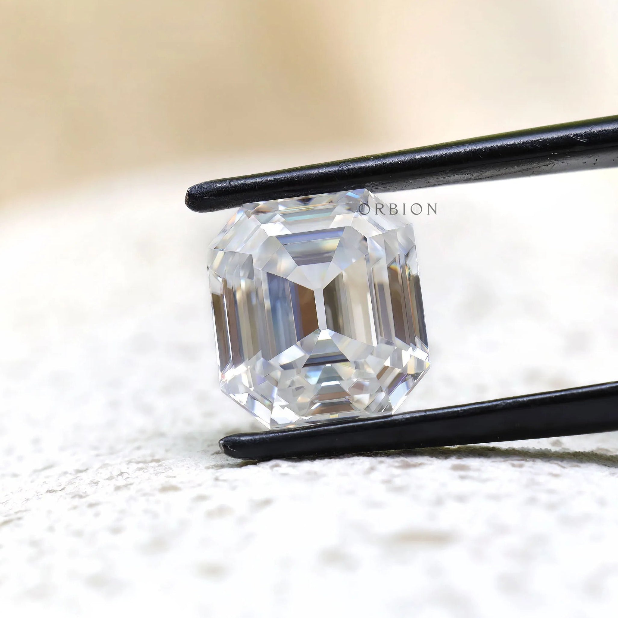 Front view of emerald step cut loose moissanite stone