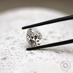 DEF pear lab diamond in tweezers with crisp faceting