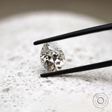 DEF pear lab diamond in tweezers with crisp faceting