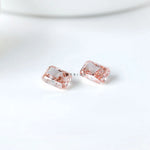 Two radiant pink lab diamonds shown pavilion side