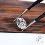 Back view of oval lab diamond with pointed tweezers